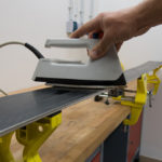 The wax is then melted with an iron to penetrate the coating. | Photo: Franz Mösbauer